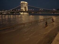 Biking on the Sztehlo GÃƒÂ¡bor road through floodwater Stock Footage