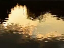 Wave Pattern on the Water with Sunset Reflection Stock Footage