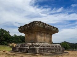 Shot of Godalsajiseokjodaejwa(pedestal, Korea Treasure 8) and tree at Godalsaji temple site Stock Footage