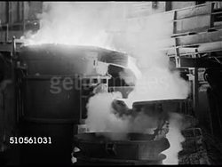 1947: CALIFORNIA INDUSTRY: STEEL: WS Steel Mill w/ several smokestacks. Liquid steel pouring from container, steam rising. Molten steel & sparks. FACTORY: HA WS Factory buildings w/ houses on hill BG. Instructional Video