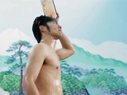 MS, LA A man pours water over his head in a traditional Japanese public bath house or sento / Tokyo, Japan Stock Footage