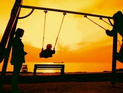 Woman with kids on the playground Stock Footage