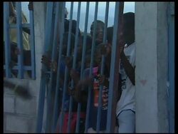 WRAP Water and food distribution in Port au Prince, crowds at WFP News Clip
