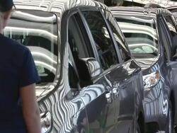 MS T/L Crew of workers inspect fully assembled mini vans / Princeton, Indiana, United States Stock Footage