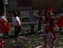A woman runs a marathon in a cancan costume near New York City's Woolworth Building. Stock Footage