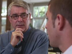 CU TU  View of two business men talking in office area  / Portland,OR,United States Stock Footage