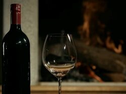HD DOLLY: Red Wine By The Fireplace Stock Footage