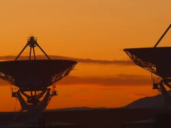 Very Large Array Radio Telescopes near Socorro, New Mexico, USA. Silhouetted against red dusk sky Stock Footage