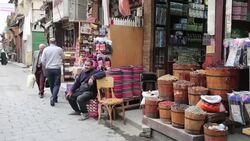 Seller sitting at a local food store at Cairo street market Stock Footage