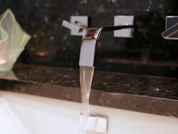 MS Shot of flowing water in modern home bathroom sink / Lake Oswego, Oregon, United States Stock Footage