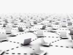 Close-up on laptop screen pulls back to reveal innumerous connected laptops Stock Footage