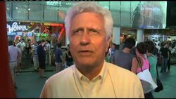 Times Square scenes, analyst on lowering of credit rating Instructional Video