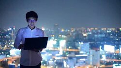 Young business man using laptop Online shopping with smart phone Stock Footage