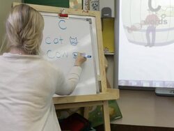 MS Teacher preparing lesson plan about learning alphabet in classroom at school / Minneapolis, Minnesota, United States Stock Footage