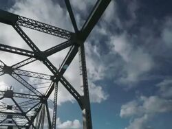 MS SLO MO POV Shot of driving over bridge looking up at top of bridge and sky /  San Francisco, California, United States Stock Footage