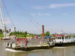WS Passing of two tug boats, deconstruction of bridge over river Mosel / Wellen, Rhineland Palatinate, Germany Stock Footage