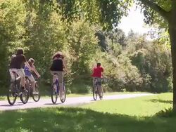 WS PAN Family with bicycle at mosel valley / Nittel, Rhineland-Palatinate, Germany                              Stock Footage