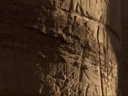Close Up, tilt-up - A close-up view shows carvings of hieroglyphs on the column of an old Egyptian adobe building / Egypt Stock Footage