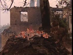 Daytime scenes at village threatened by fires Instructional Video