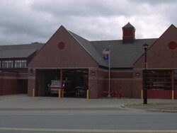 WS View of  brick firehouse garage and thick cloudy stormy sky/ Halifax, Nova Scotia, Canada, United States Stock Footage