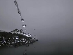 CU SLO MO Water falling into Water against Grey background / Vieux Pont, Normandy, France Stock Footage
