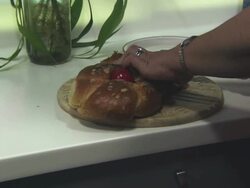 MS Woman cutting and serving  traditional Greek Orthodox Christian brioche / Greece Stock Footage