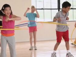 MS PAN Elementary School children hula hooping in gym / Richmond, Virginia, United States     Stock Footage