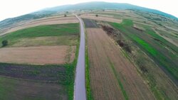 Aerial panorama over green fields farms summer Stock Footage