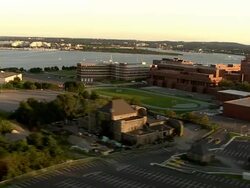 LOW AERIAL, University of Massachusetts campus and John F. Kennedy Presidential Library and Museum, Boston, Massachusetts, USA Stock Footage