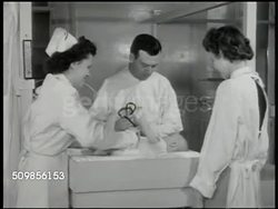 1946: NEW YORK FOUNDLING HOSPITAL: Nurse working in room w/ babies, children in cribs. One child standing in crib w/ something in mouth. Doctor giving baby checkup, nurse helping. CU Baby chewing stethoscope, baby w/ stethoscope on chest, paperwork. Instructional Video