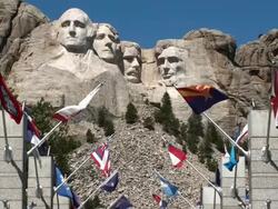 Flags Flying below Mount Rushmore Stock Footage