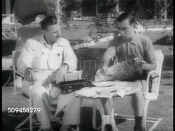 1937: EDDIE CANTOR: WS Unidentified writer w/ comedian Eddie Cantor (1892-1964) in backyard, SOT Eddie looking in paper for joke ideas, writer picking story, Eddie making political excavating joke, then deciding against it. 'Republicans buy gas too.' Instructional Video