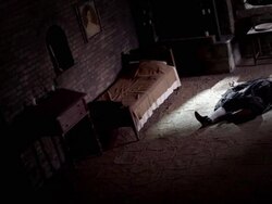 Light shines through a bedroom window near a dead man on a floor. Stock Footage