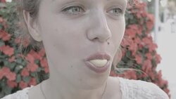 Young woman making a big bubble with a chewing gum Stock Footage