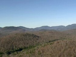 MS AERIAL ZI Small lake surrounded by tree at Adirondacks park / New York, United States Stock Footage