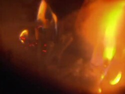 Wood Burning Stove Being Lit at Home News Clip