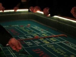 Casino footage, gambling chips and dice on craps table Stock Footage