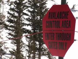 MS Shot of avalanche control warning sign after winter storm / Alta, Utah, United States Stock Footage