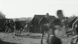 1942 MONTAGE Children running toward a mess tent where they eat during harvest time / United Kingdom Stock Footage