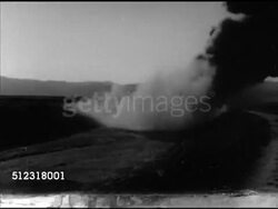 1952: KOREAN WAR:  VS Explosion on field w/ hills around, United States Marine climbing into tank, tanks firing cannons, firing large shell machine gun. Infantry, Korean Conflict Instructional Video