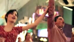 Friends shout along with band at outside concert in downtown Las Vegas Stock Footage