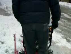 MS PAN ZO TU TD Man using snow blower to clear snow in Wall St. area / New York, New York, United States   Stock Footage