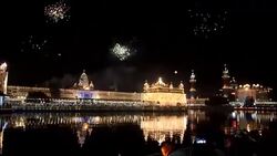 CLEAN : Indian devotees watch supermoon rise above temple in Amritsar News Clip