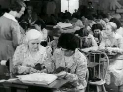 B/W 1934 room full of women sewing in WPA garment factory / documentary Stock Footage