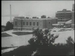 A prison guard stands near a window at Sing Sing prison in 1932. Stock Footage