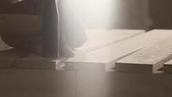 Carpenter hammering nail Stock Footage