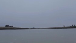 Young man skating in underwear on frozen pond in winter in rural Montana, USA. Stock Footage