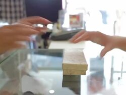 Customer to pay money for goods with the women cashier Stock Footage