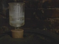 HD DOLLY: Wine Fermenting In Barrel Stock Footage