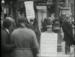Men advertise new businesses on stilts and with sandwich boards. News Clip